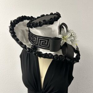 Elegant Black and White Hat with Floral Accent